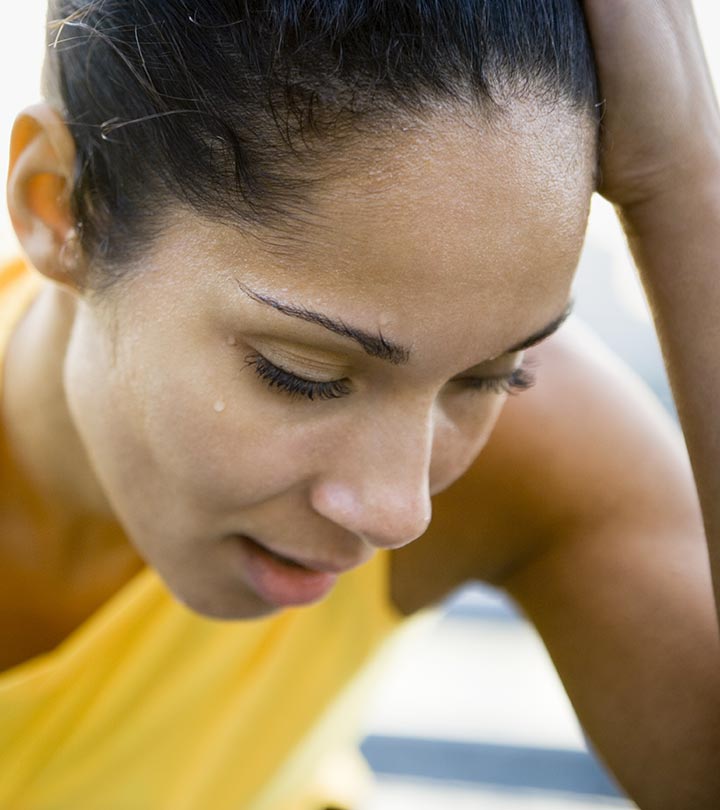 A woman with sweat on her face