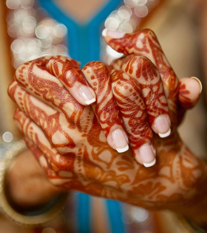 A woman with mehandi on hands