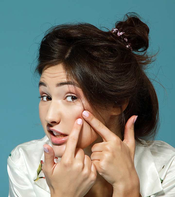 Woman with a pimple on her left cheek Woman with a pimple on her left cheek