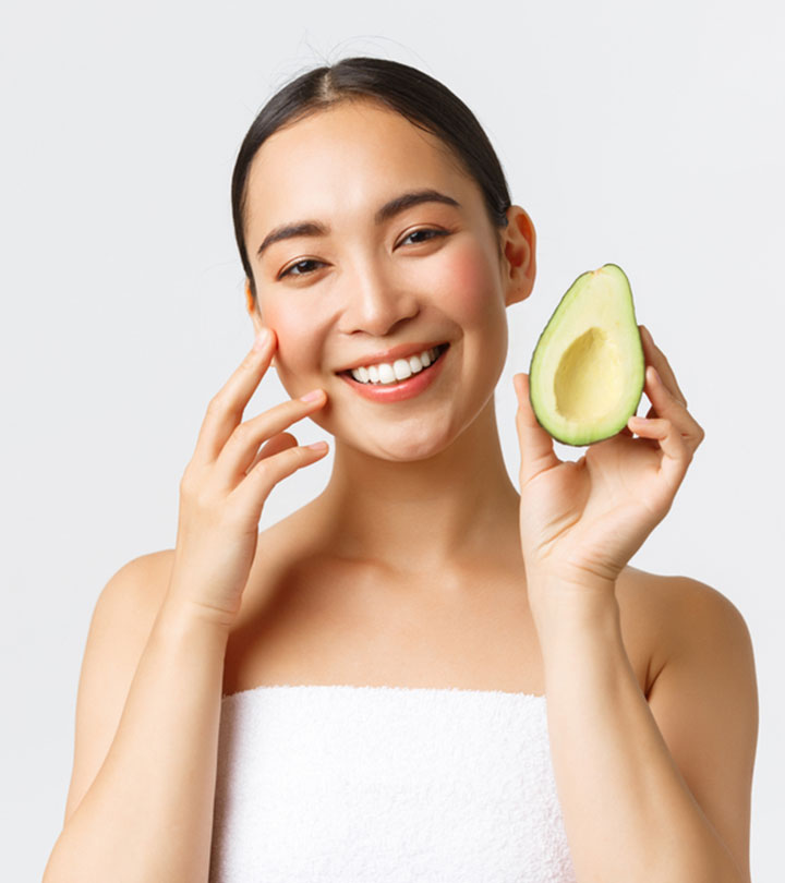 Women With Homemade Avocado Face Mask Women With Homemade Avocado Face Mask