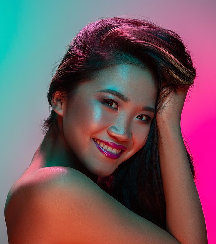 An east asian lady with pink hair color