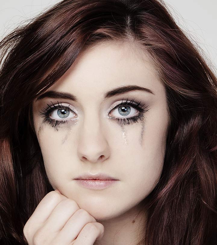 A woman crying and the makeup messes up