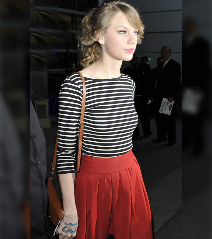 Taylor swift with a tattoo on her hand