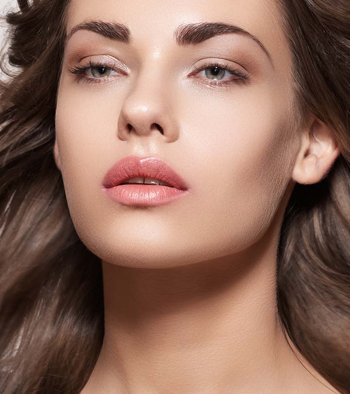 A woman with dark eyebrows