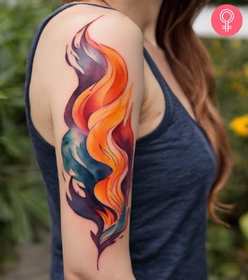 Woman with flame tattoo on her arm Woman with flame tattoo on her arm