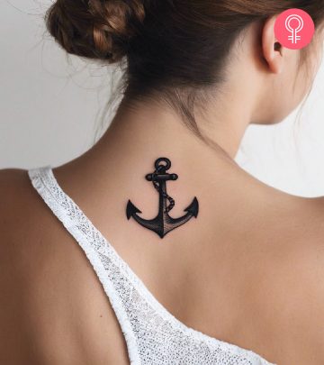 Woman wearing an anchor tattoo on the nape Woman wearing an anchor tattoo on the nape