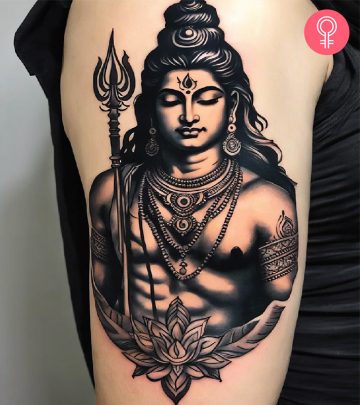A woman with a Shiva tattoo design on her forearm A woman with a Shiva tattoo design on her forearm