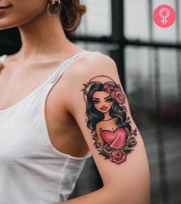 A Bratz doll tattoo with flowers on the upper arm A Bratz doll tattoo with flowers on the upper arm