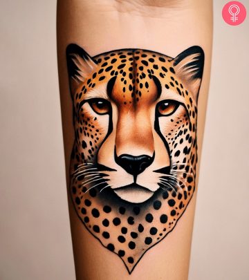 A cheetah tattoo on a woman’s arm A cheetah tattoo on a woman’s arm