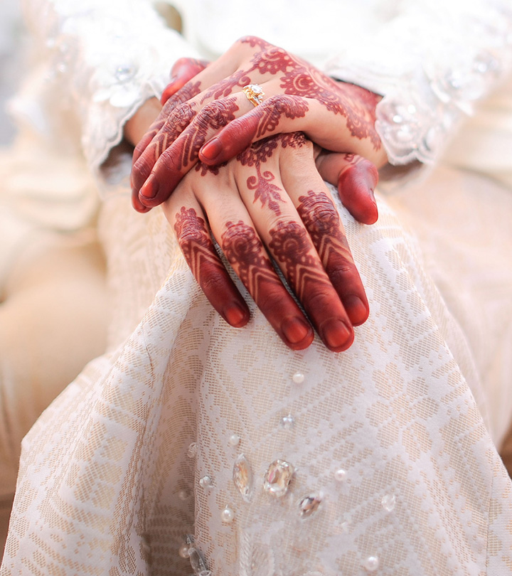 A close-up of a Muslim woman with a temporary henna tattoo