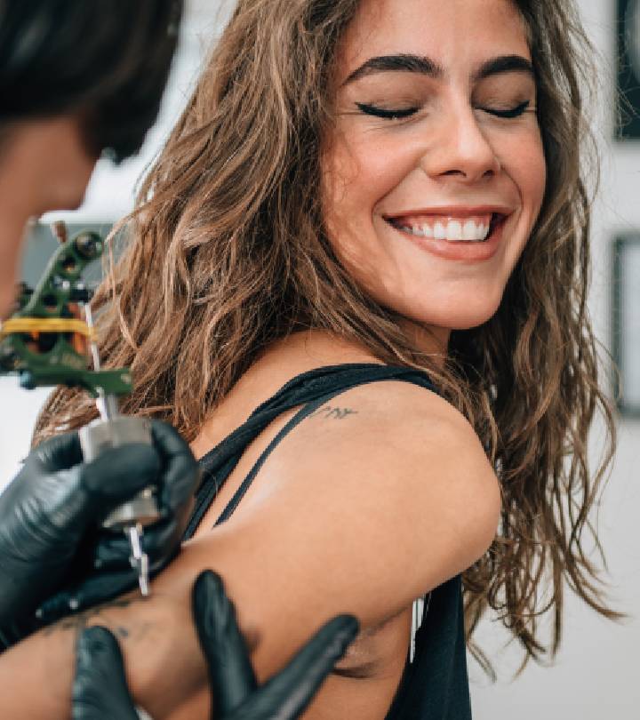 A girl getting a tattoo on her tricep. A girl getting a tattoo on her tricep.