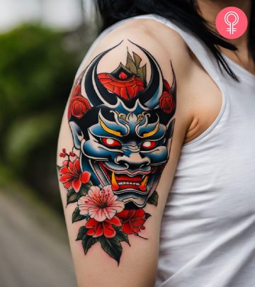 Japanese skull tattoo on the upper arm of a woman