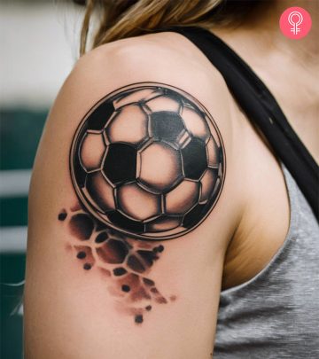A stylish soccer tattoo on the arm of a woman A stylish soccer tattoo on the arm of a woman