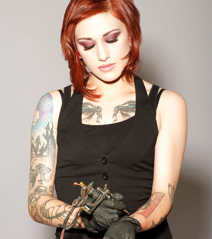 A woman tattooing herself