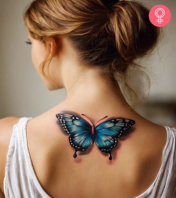 A woman with a 3D butterfly tattoo on her back A woman with a 3D butterfly tattoo on her back