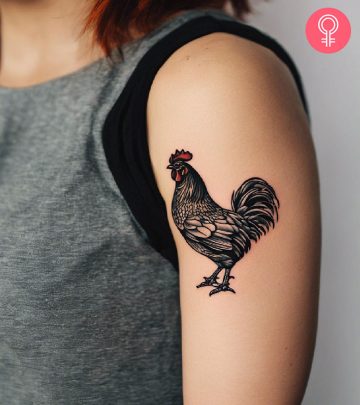 A woman with a chicken tattoo on her arm A woman with a chicken tattoo on her arm