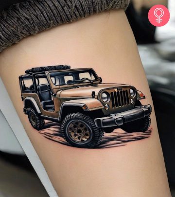 A woman with a colorful jeep tattoo on her upper arm A woman with a colorful jeep tattoo on her upper arm