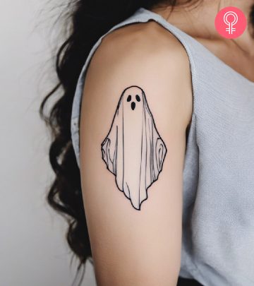 Top 8 Ghost Tattoo Ideas With Their Meanings A woman with an eagle and snake tattoo on her arm