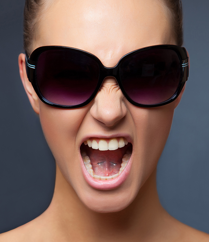 A woman with a tongue web piercing A woman with a tongue web piercing