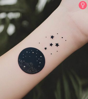 A woman with night sky tattoo on her wrist A woman with night sky tattoo on her wrist