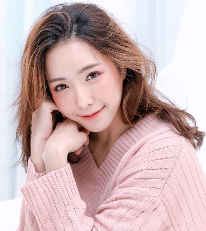 A Korean girl in a pink sweater A Korean girl in a pink sweater