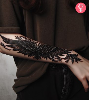 Devil wings tattoo on the forearm of a woman Devil wings tattoo on the forearm of a woman