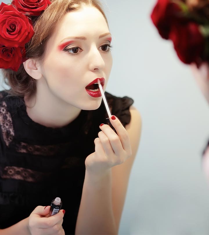 Women applying some lip product on their lips