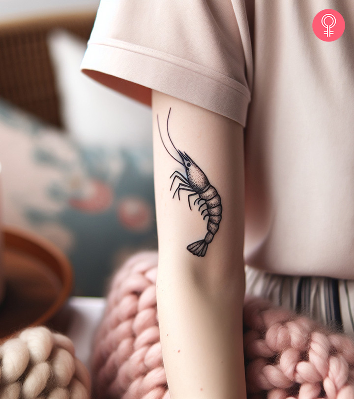 8 Eye-Catching Shrimp Tattoo Ideas With Meanings Minimalist shrimp tattoo on the upper arm