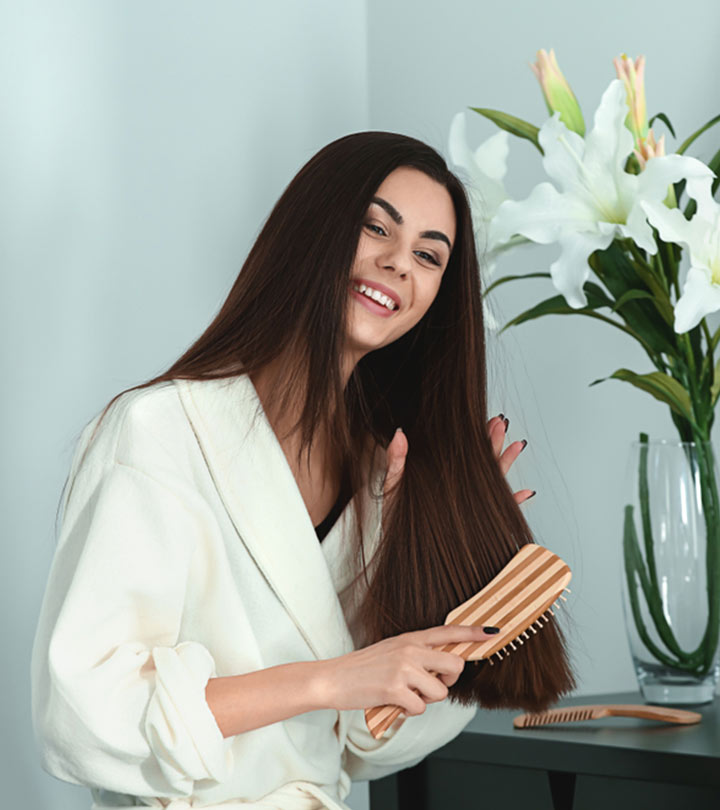 Woman brushing her hair Woman brushing her hair