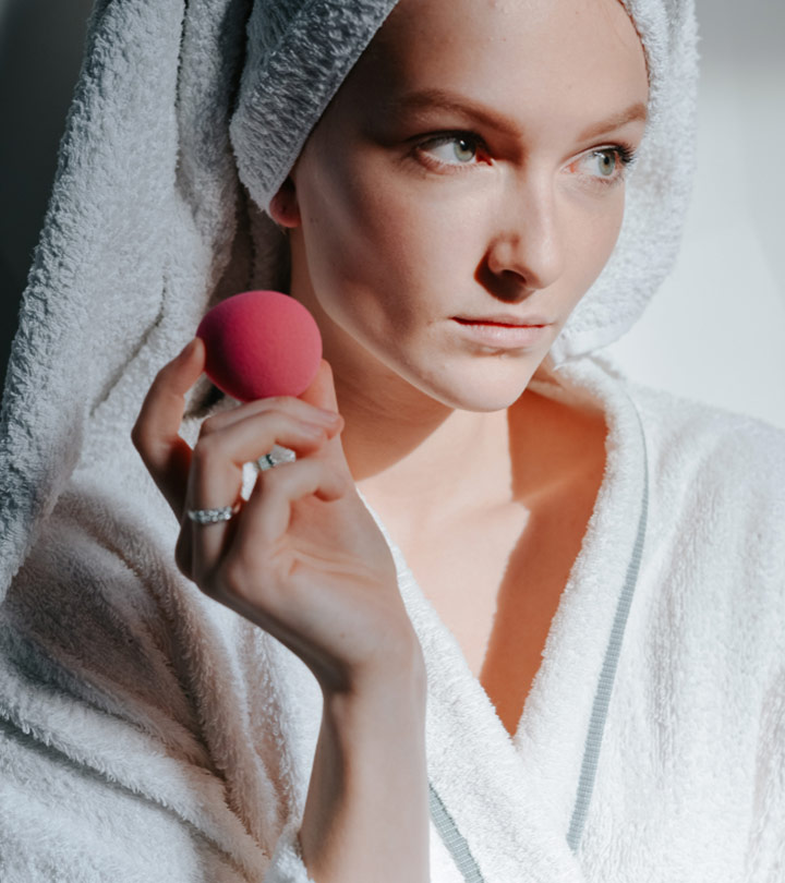 Women hold a beauty blender