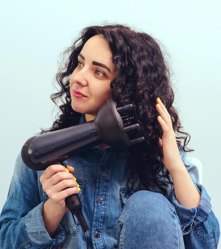 A Women Using A Diffuser To Dry Curly Hair A Women Using A Diffuser To Dry Curly Hair