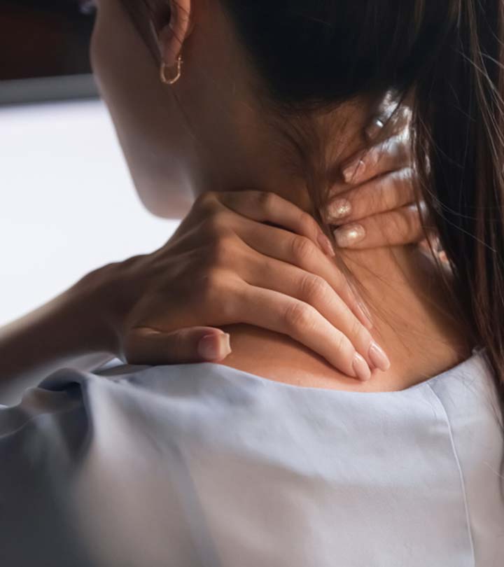 A Person Massaging Their Neck Due To Stiff Neck
