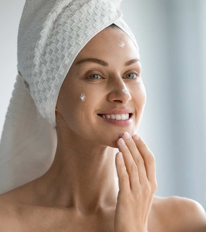 A Women Applying Moisturizer To Their Face To Hydrate It A Women Applying Moisturizer To Their Face To Hydrate It