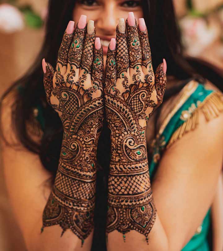 Woman With Mehendi On Her Hands
