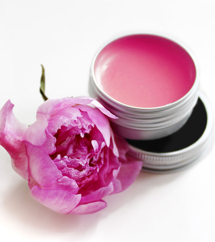 Homemade lip balm and a flower