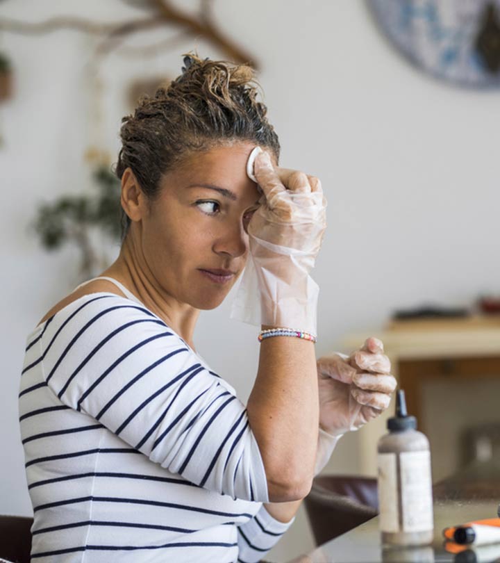 Women Removing Hair Color Stains From The Skin Women Removing Hair Color Stains From The Skin