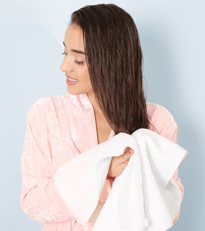 Woman Using Towel To Dry Hair To Minimize Damage Woman Using Towel To Dry Hair To Minimize Damage