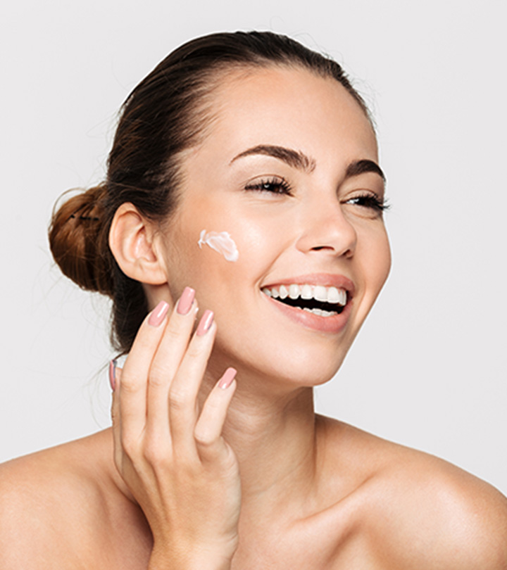 A woman with moisturizer on face