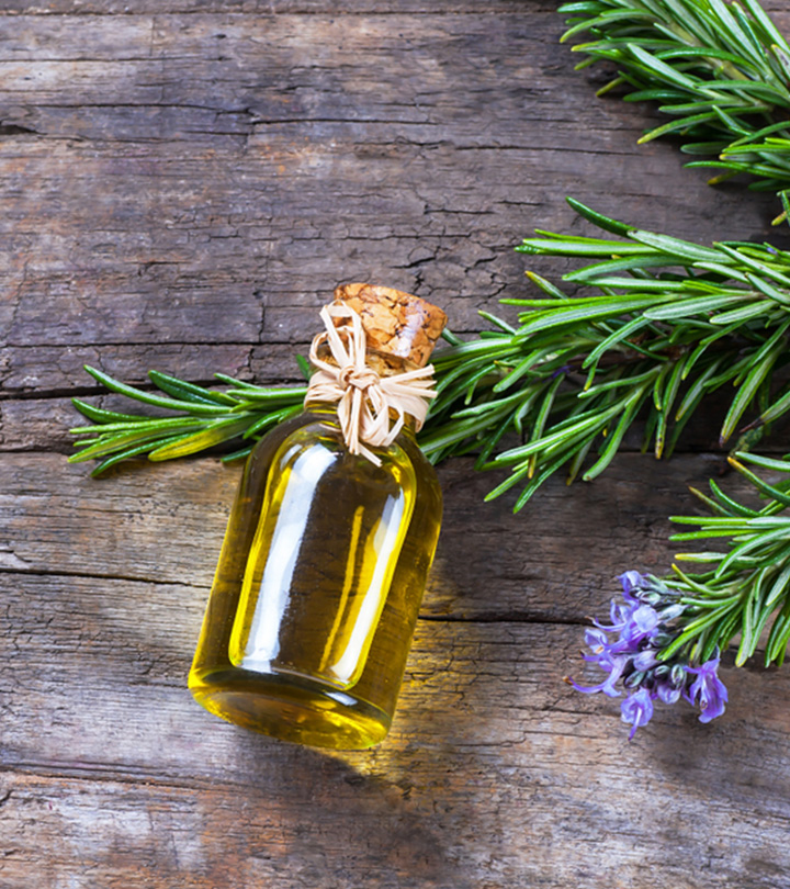 Rosemary herb and rosemary oil in a glass bottle