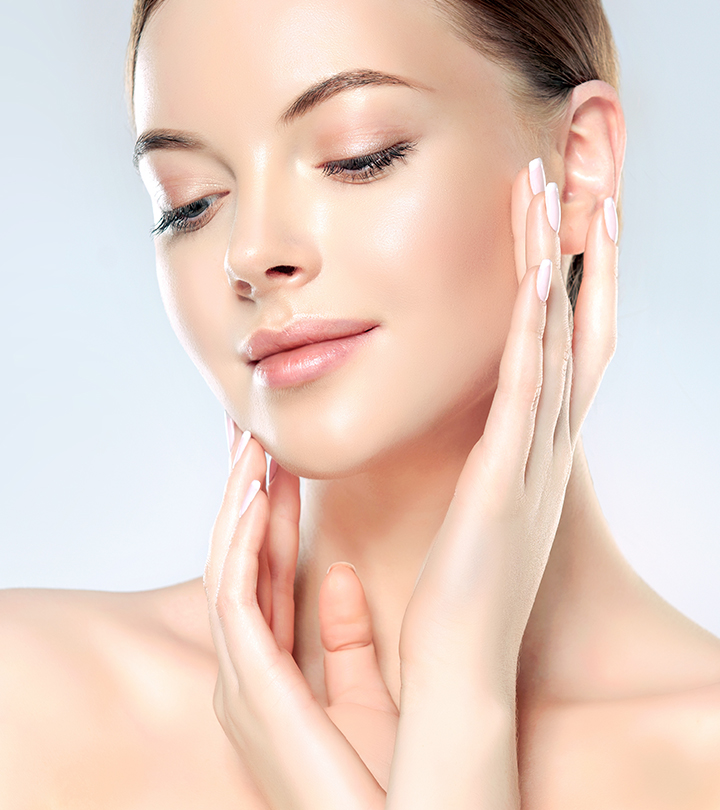 Women touching her shiny skin face Women touching her shiny skin face