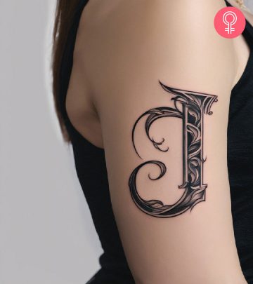 8 Unique Letter J Tattoo Ideas For Men And Women A woman wearing a ‘T’ style letter tattoo on the upper arm.