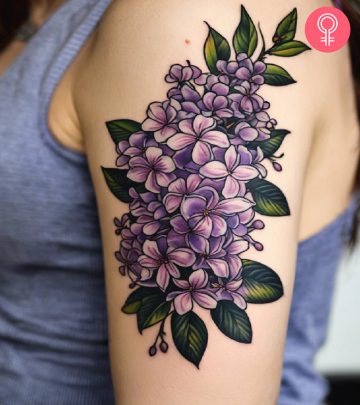 lilac tattoo on the upper arm