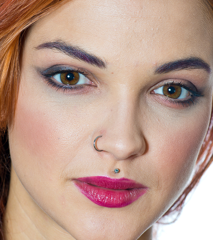 A woman with medusa piercing