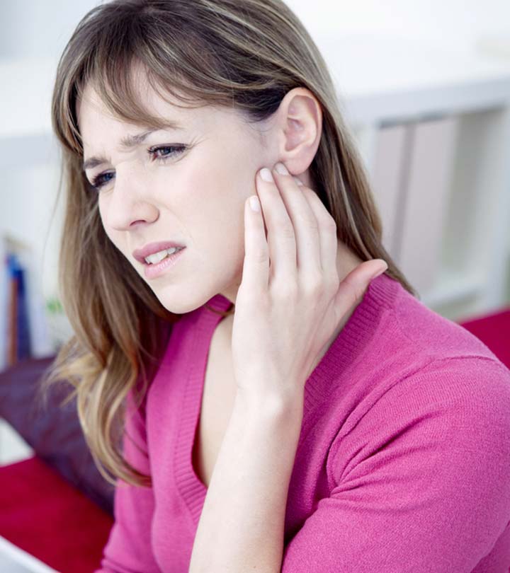 Woman with pimple behind ear