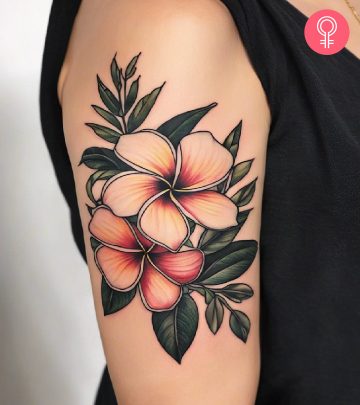 Plumeria tattoo on the upper arm Plumeria tattoo on the upper arm