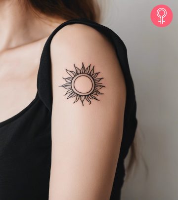 Sun tattoo on the upper arm Sun tattoo on the upper arm