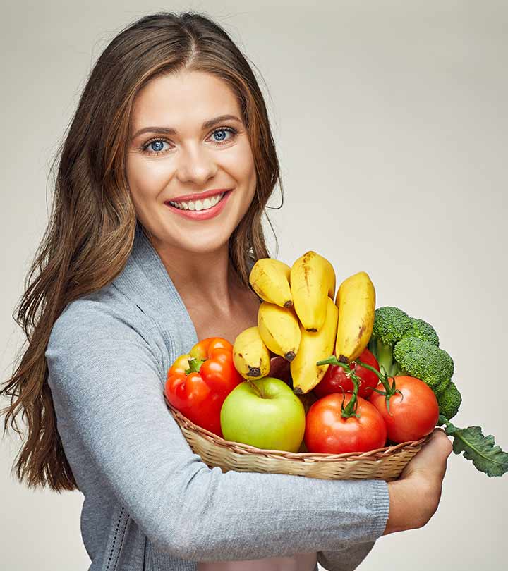 A woman carrying fruits for hair growth A woman carrying fruits for hair growth