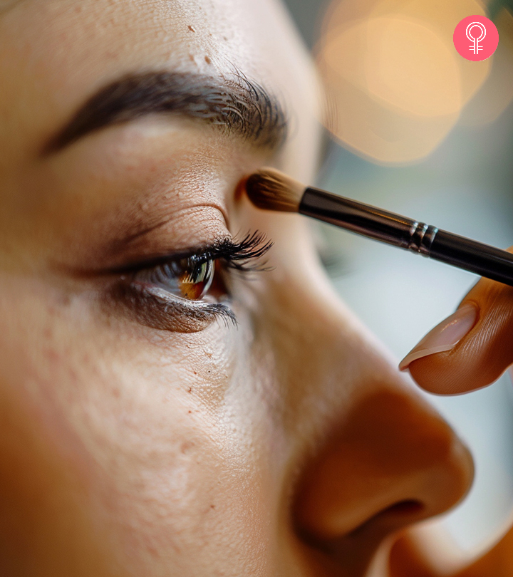 Top 25 Eye Makeup Tips For Beginners Girl applying mascara in front of a mirror