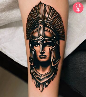 Vintage spartan helmet tattoo on a woman’s forearm Vintage spartan helmet tattoo on a woman’s forearm