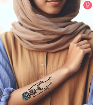 Woman with a skeleton tattoo on her arm